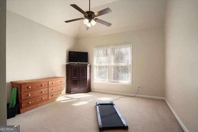 exercise area featuring light carpet, vaulted ceiling, and ceiling fan