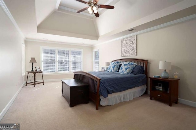 carpeted bedroom with a raised ceiling, crown molding, and ceiling fan