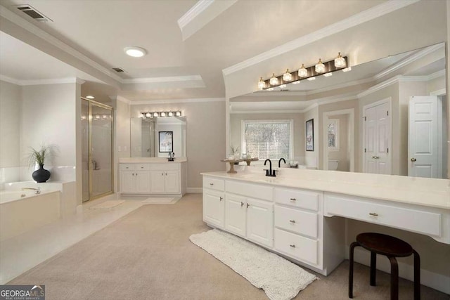 bathroom with crown molding, vanity, and independent shower and bath