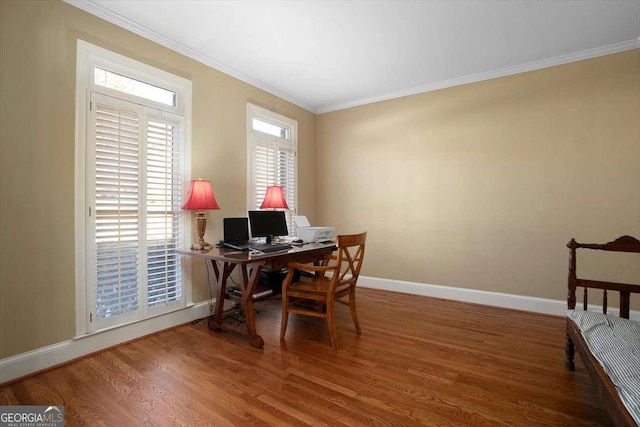 home office featuring crown molding, a wealth of natural light, and wood-type flooring