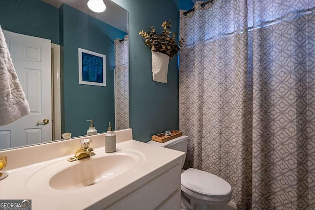 bathroom with vanity and toilet