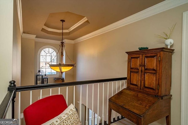 interior details featuring a raised ceiling and ornamental molding