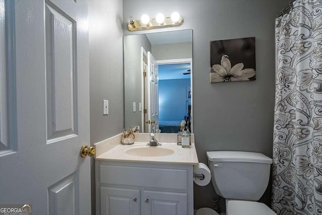 bathroom featuring vanity and toilet