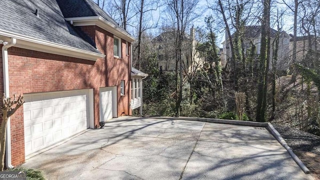 view of property exterior featuring a garage