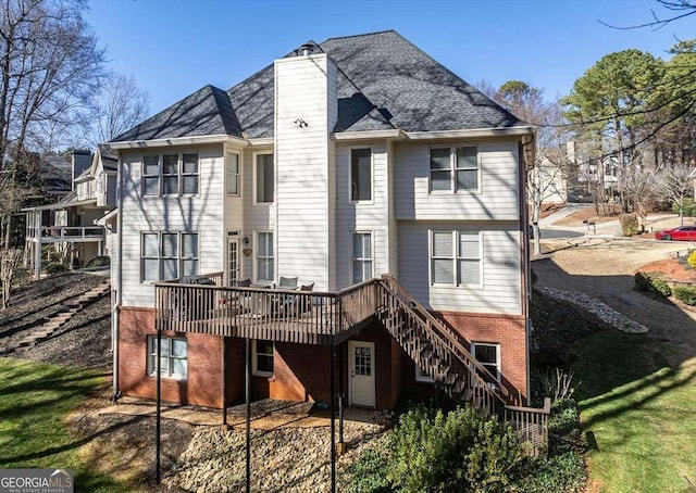 rear view of house featuring a deck