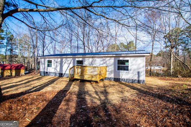 view of front of property featuring a wooden deck