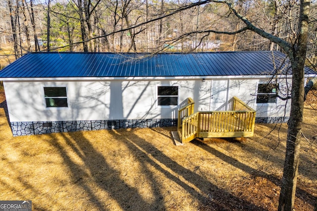 exterior space featuring a yard and a deck