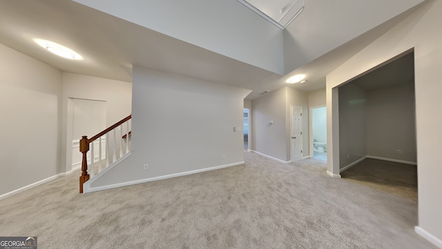 spare room with light colored carpet