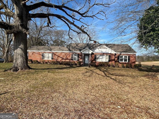 ranch-style house with a front lawn