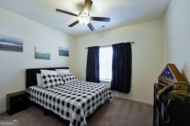 bedroom featuring ceiling fan and dark colored carpet