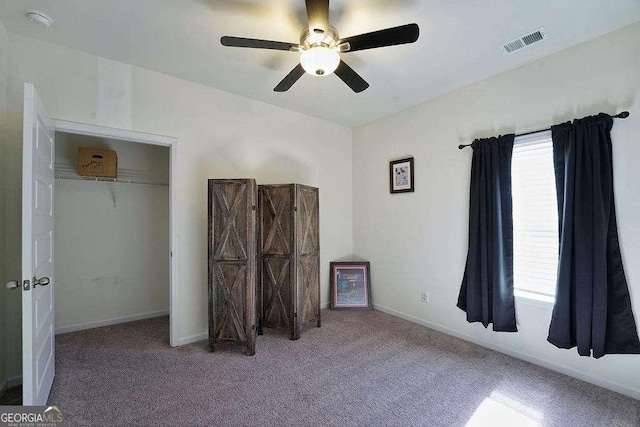 unfurnished bedroom with carpet flooring and ceiling fan