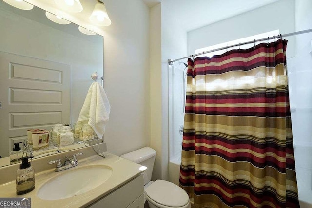 bathroom featuring vanity and toilet