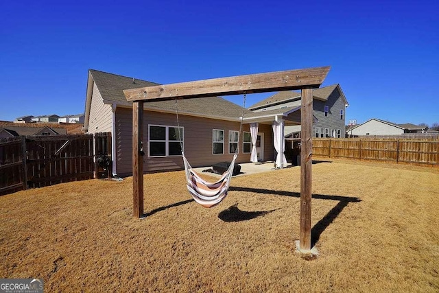 rear view of house featuring a patio area