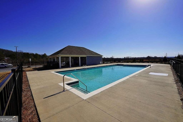 view of pool featuring a patio