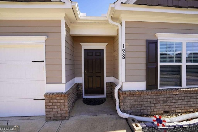 entrance to property featuring a garage