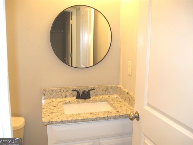 bathroom with vanity and toilet