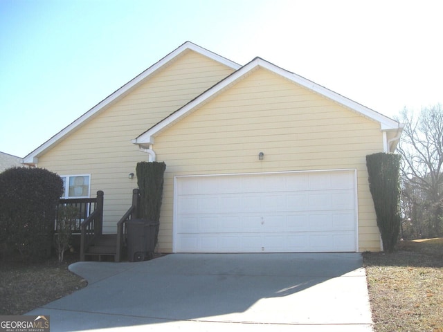 view of side of home featuring a garage