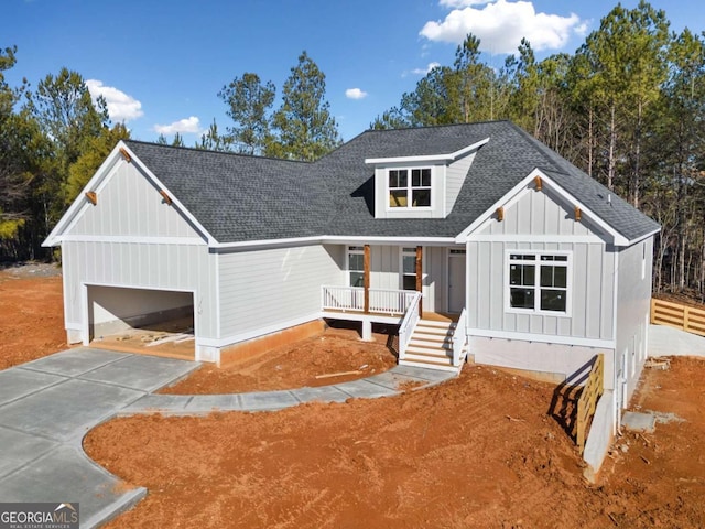 view of front facade featuring a garage and covered porch