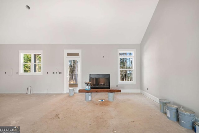 living room with vaulted ceiling and a wealth of natural light