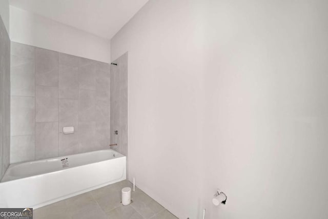 bathroom with tile patterned floors and tiled shower / bath