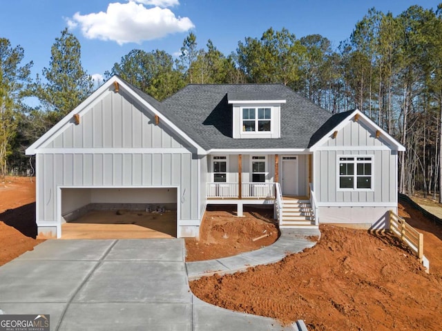 view of front of property with a garage and covered porch