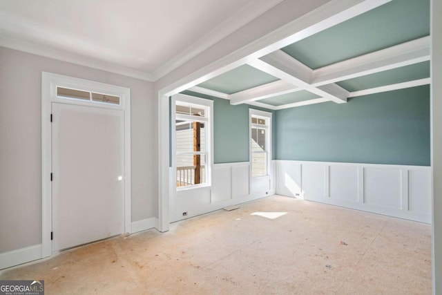 empty room with crown molding, coffered ceiling, and beam ceiling