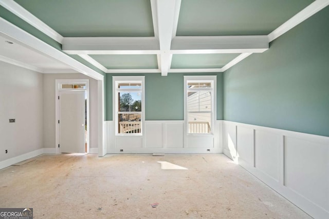 unfurnished room with crown molding, coffered ceiling, and beam ceiling