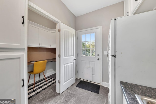 entryway featuring built in desk