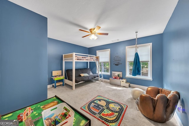 carpeted bedroom featuring ceiling fan