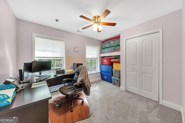 office featuring light carpet and ceiling fan