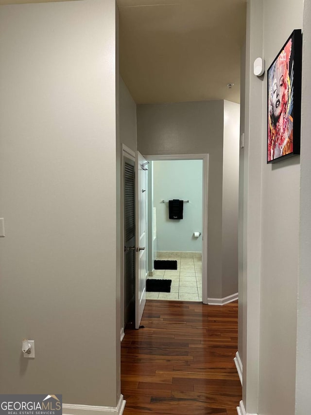 hallway featuring dark wood-type flooring