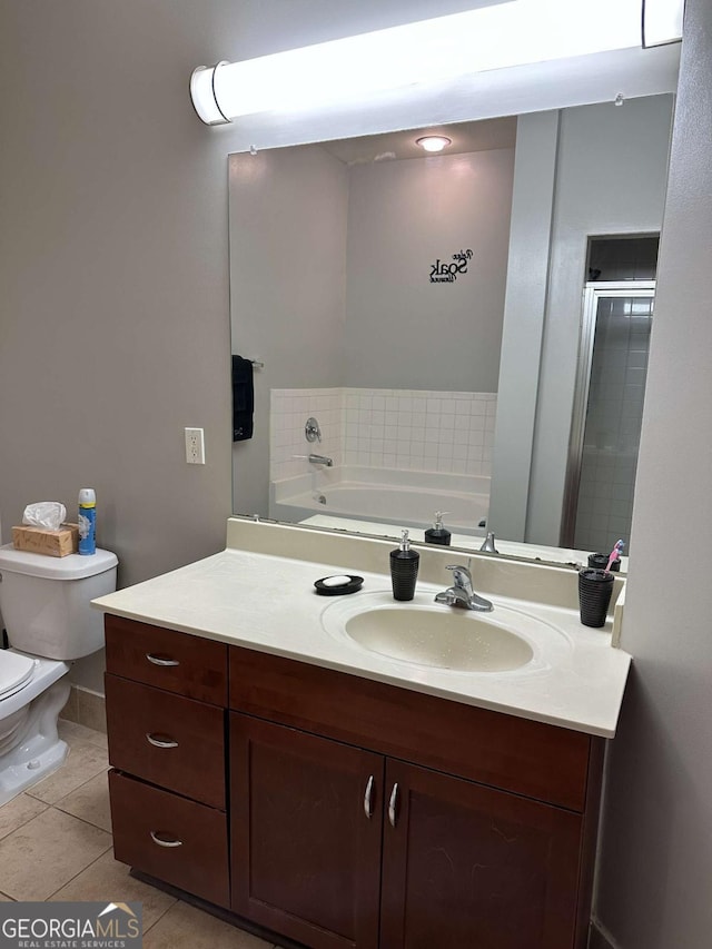 full bathroom with tile patterned flooring, vanity, toilet, and separate shower and tub