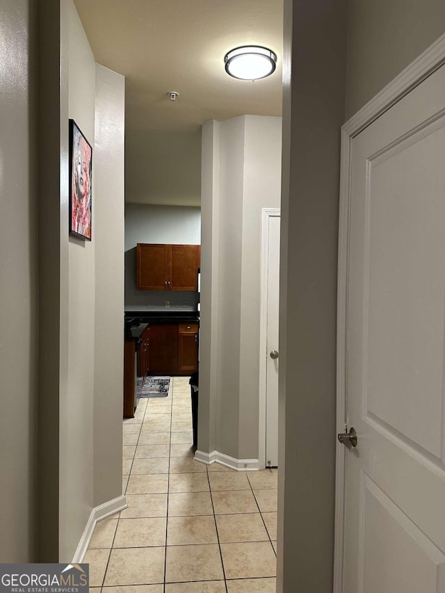 corridor featuring light tile patterned flooring