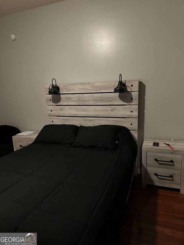 bedroom featuring dark hardwood / wood-style floors