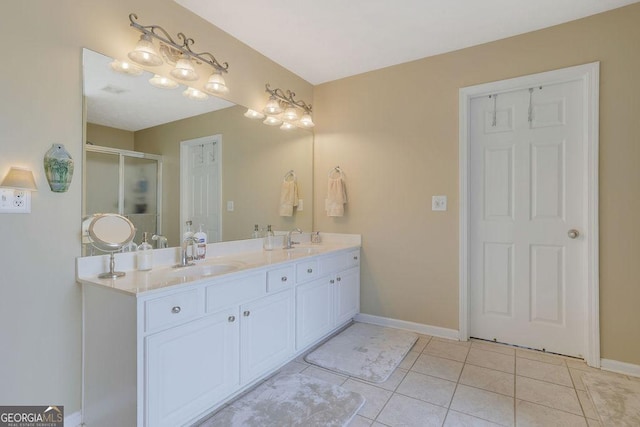 bathroom featuring vanity, an enclosed shower, and tile patterned floors