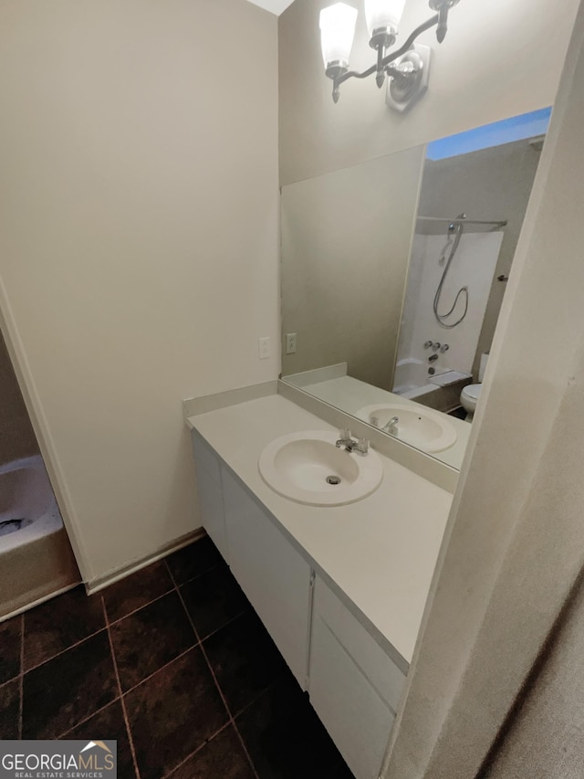 bathroom with vanity, shower / washtub combination, a notable chandelier, and tile patterned floors