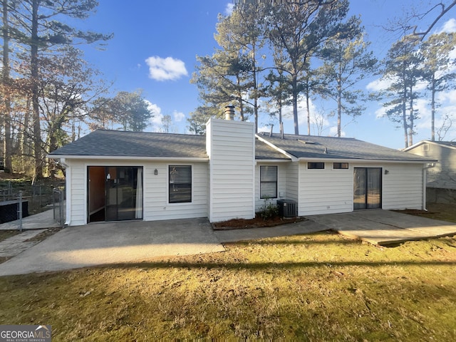 back of property with a patio