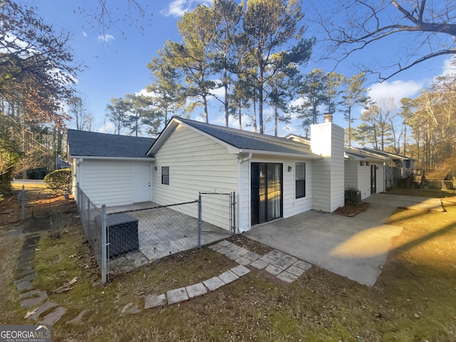 rear view of property featuring a patio area