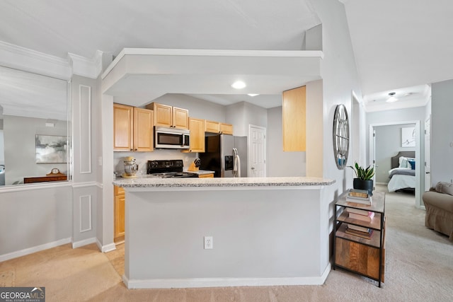 kitchen featuring light carpet, light brown cabinetry, and appliances with stainless steel finishes