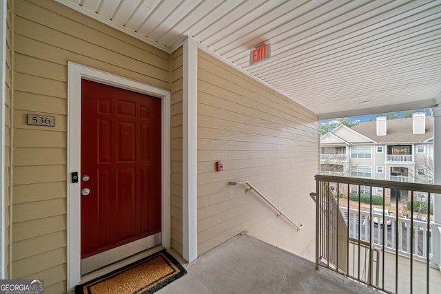 property entrance with a balcony