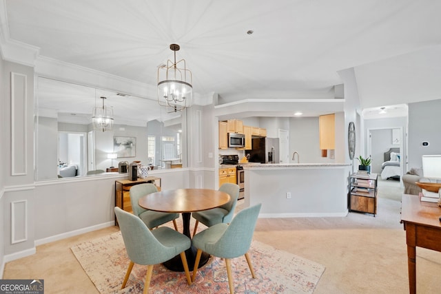 carpeted dining space featuring ornamental molding, sink, and a notable chandelier