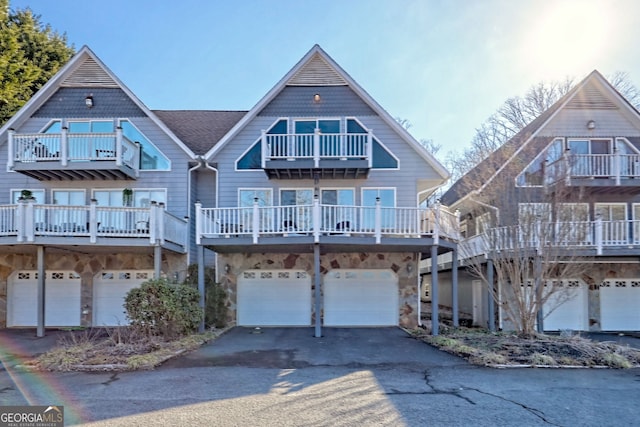 view of front facade featuring a balcony and a garage