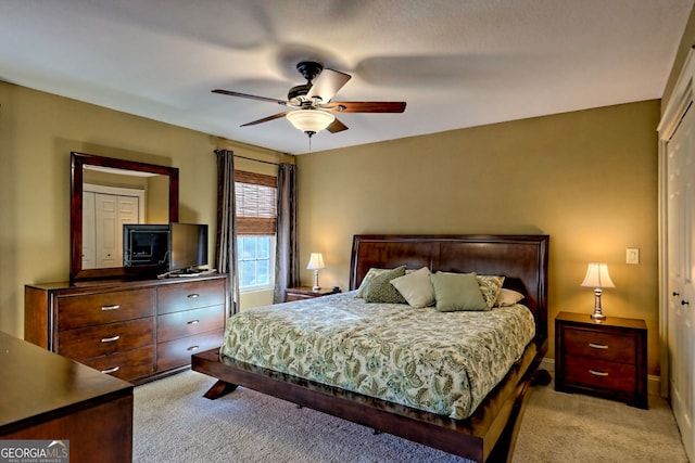 carpeted bedroom featuring ceiling fan