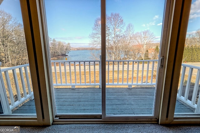 doorway to outside featuring a water view