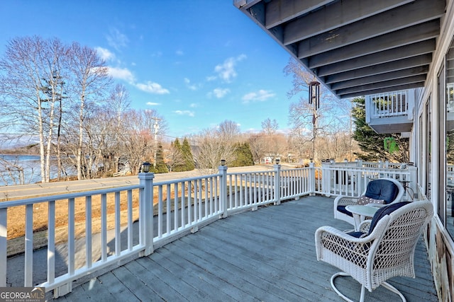 deck featuring a water view