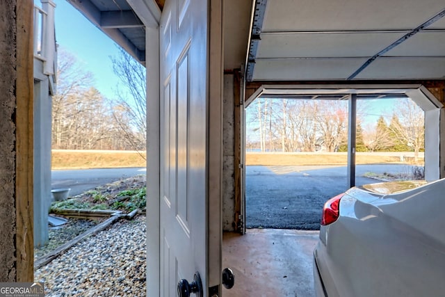 doorway to outside with concrete floors