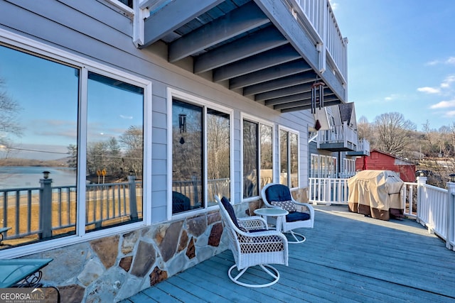 deck featuring a grill