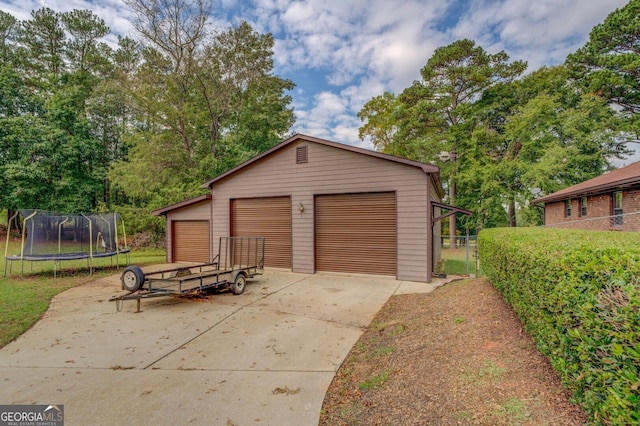 detached garage featuring a trampoline