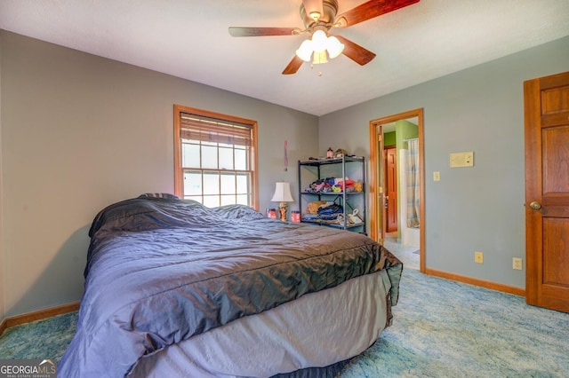 bedroom featuring light carpet, ceiling fan, and baseboards