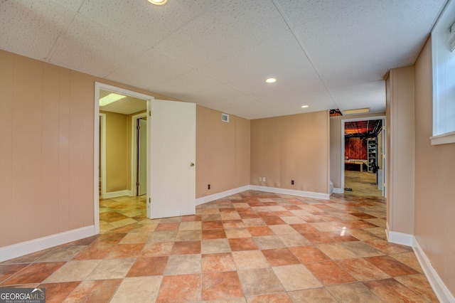 finished basement featuring recessed lighting, visible vents, and baseboards